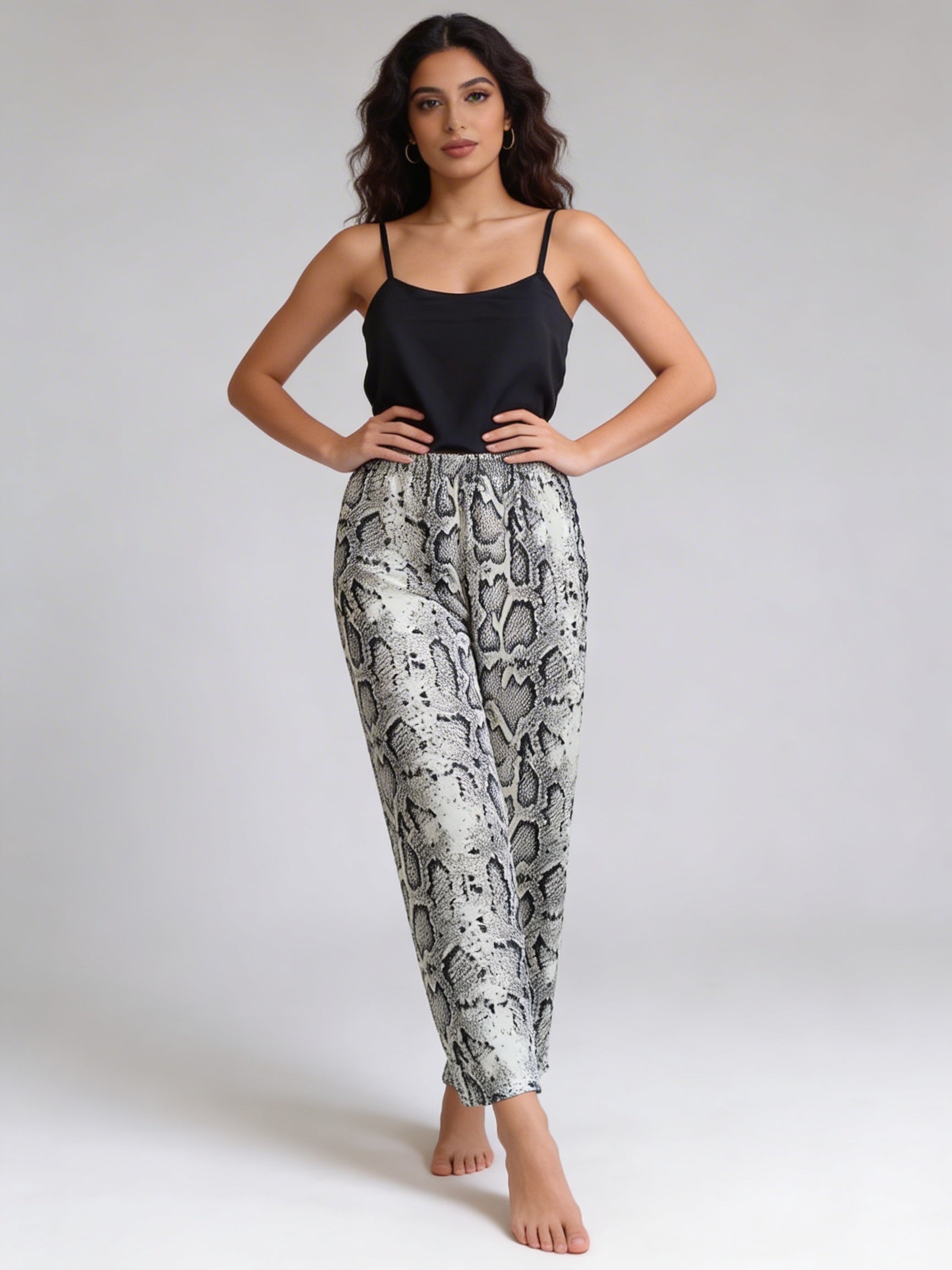 White snake pants with black cut top