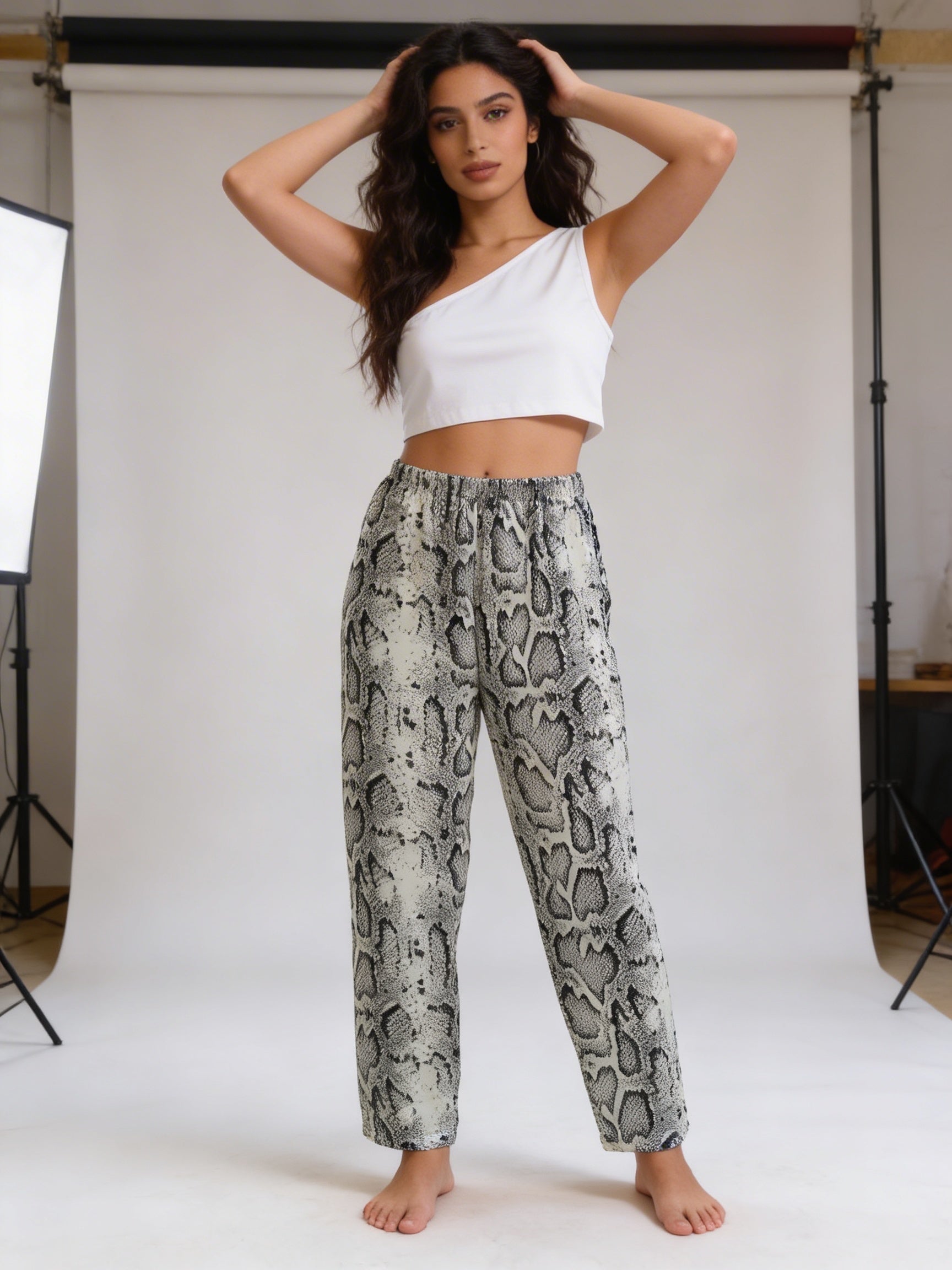 White one shoulder with white snake pants