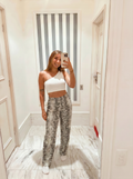 White snake pants with white one shoulder