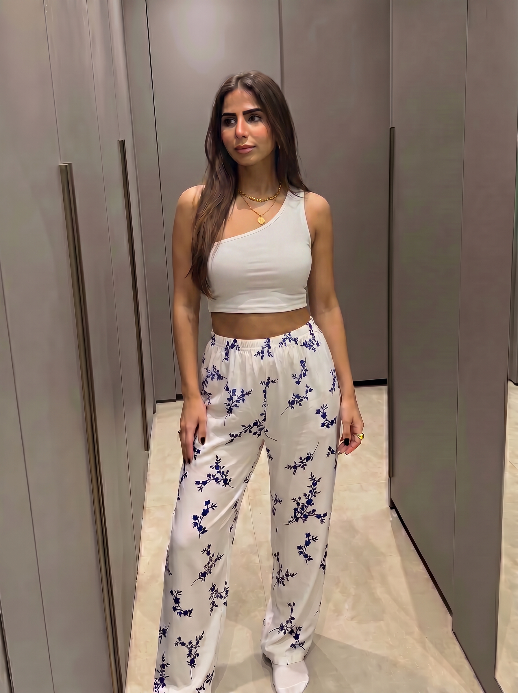 White blue pants with white one shoulder top